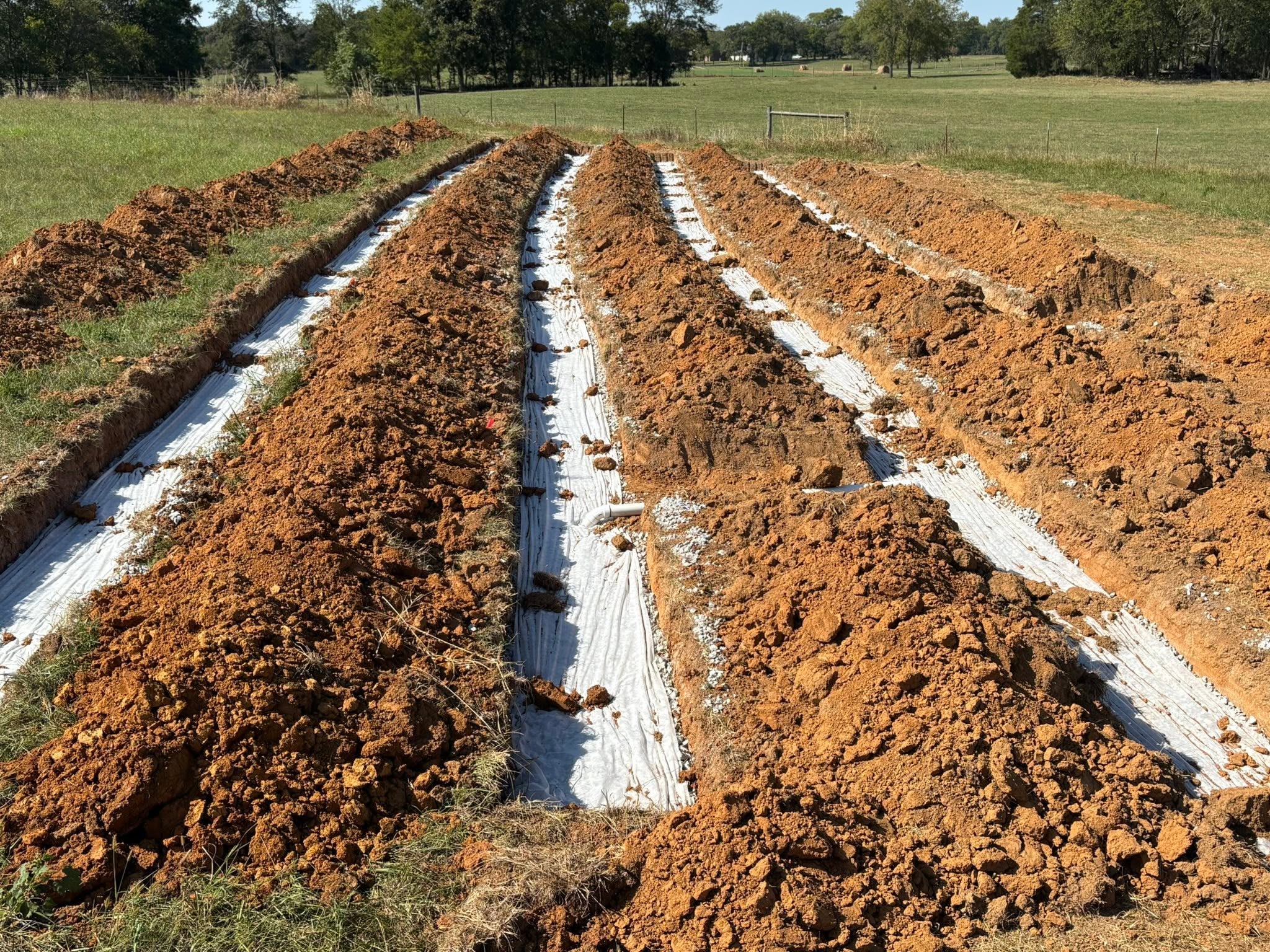 Septic system drain field trenches excavated in Lebanon, TN red clay