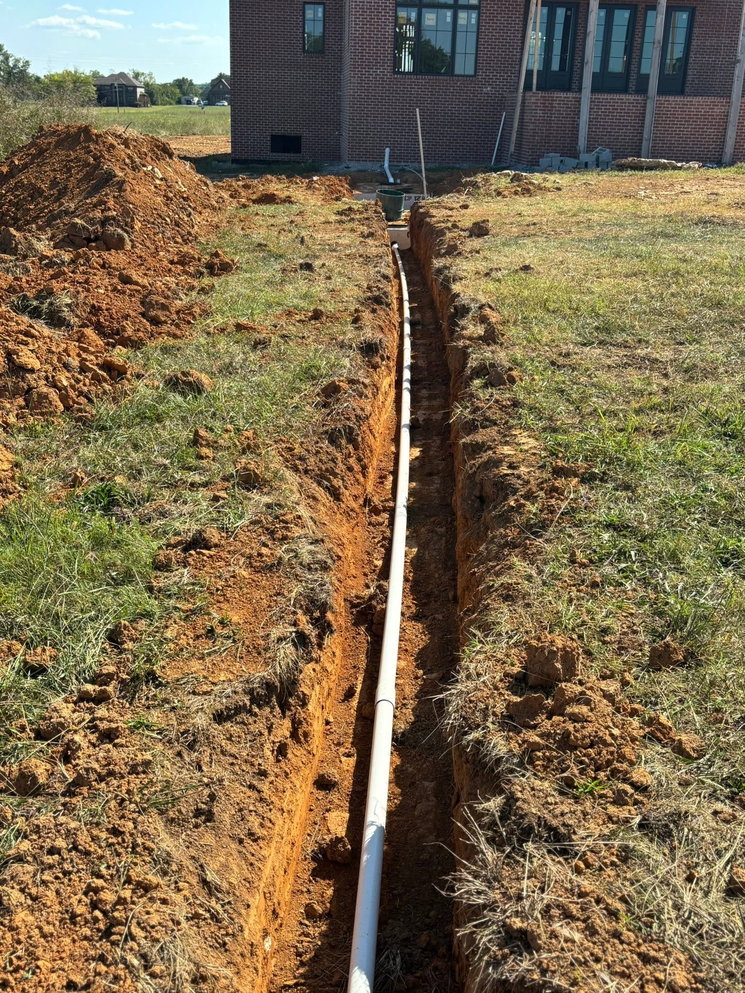 Utility contractor PVC pipe trench for residential construction in Wilson County