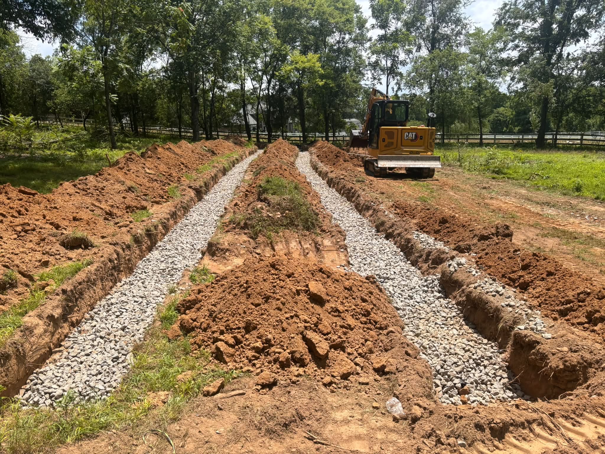 Septic system gravel trenches with excavator on a Lebanon, TN property