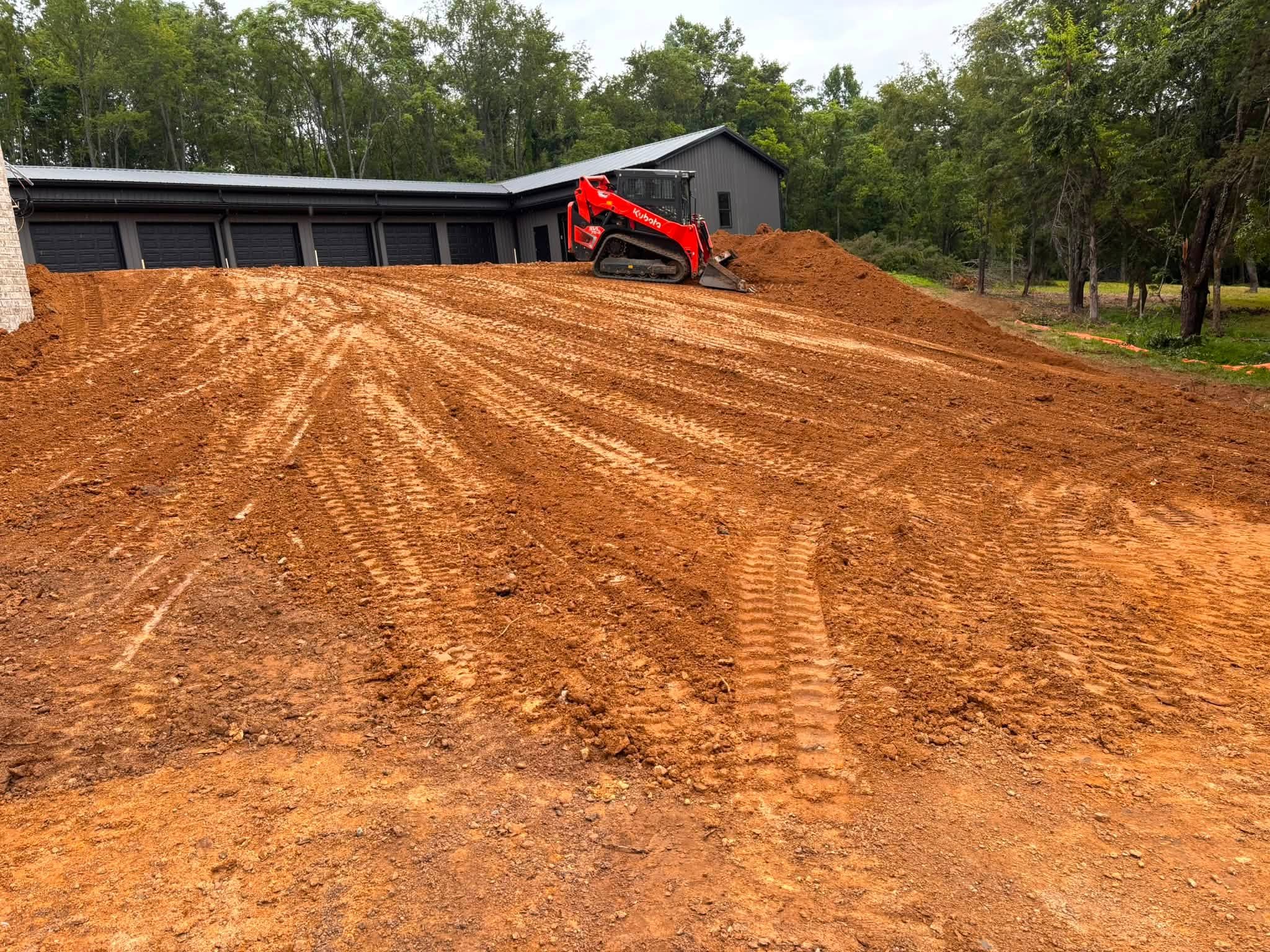 Compact track loader grading commercial construction site in Lebanon, TN